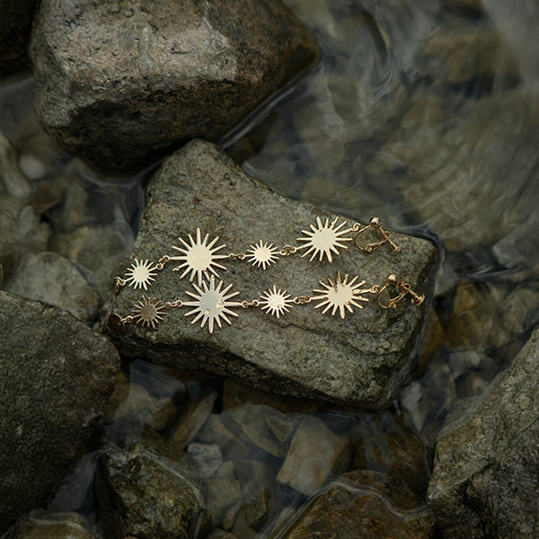 Golden sun hanging clip on earrings