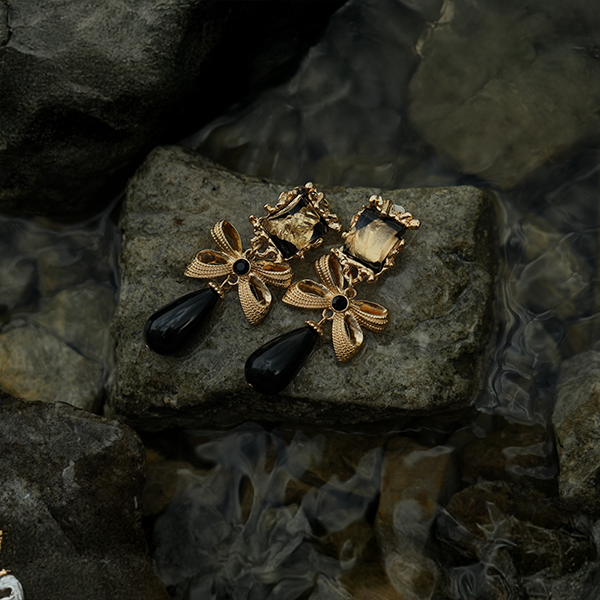 Statement gold and emerald drop clip on earrings