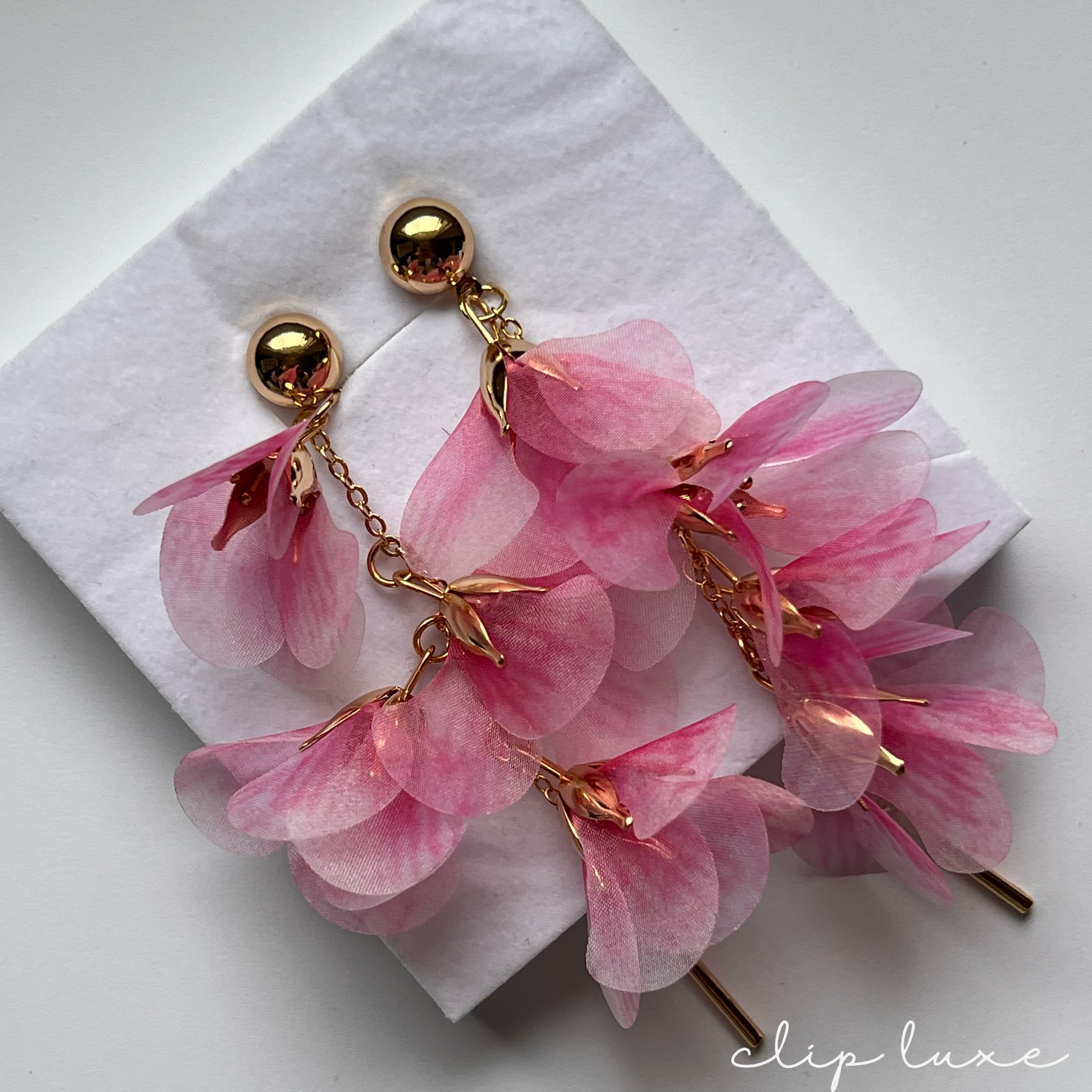 Flowing pink petal gold clip on earrings