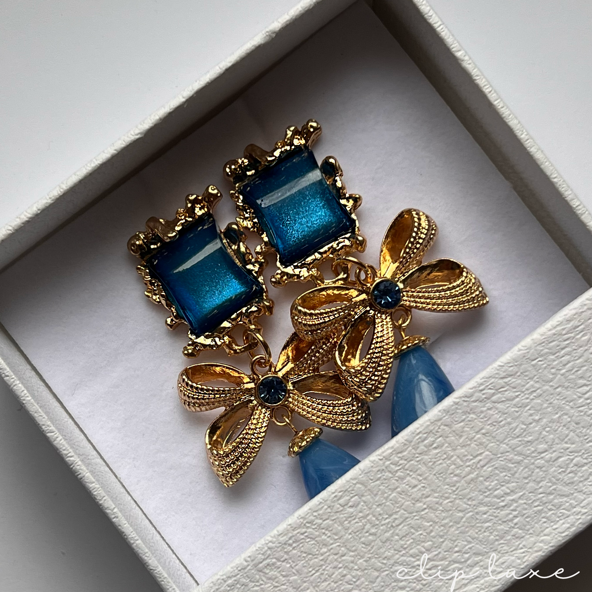 Gold and royal blue dangle clip on earrings