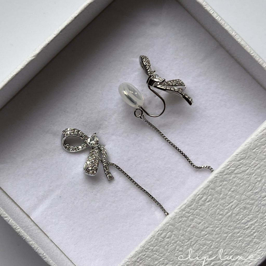 Petite silver half bow clip on earrings