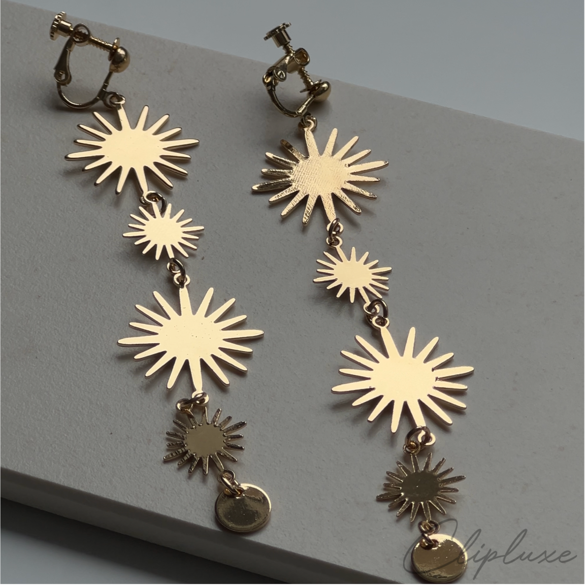 Hanging suns Clip-on earring