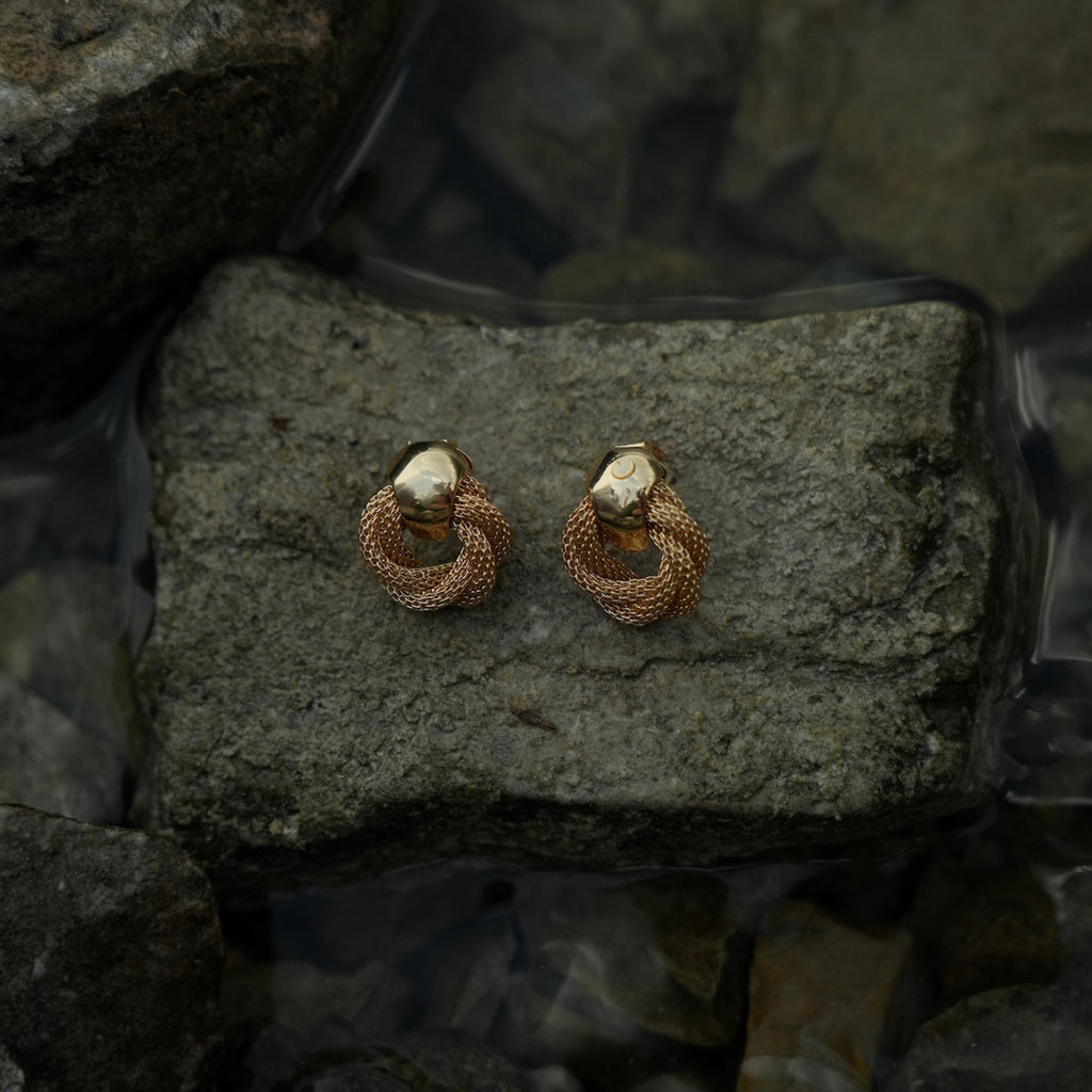 Twisted gold clip on earrings