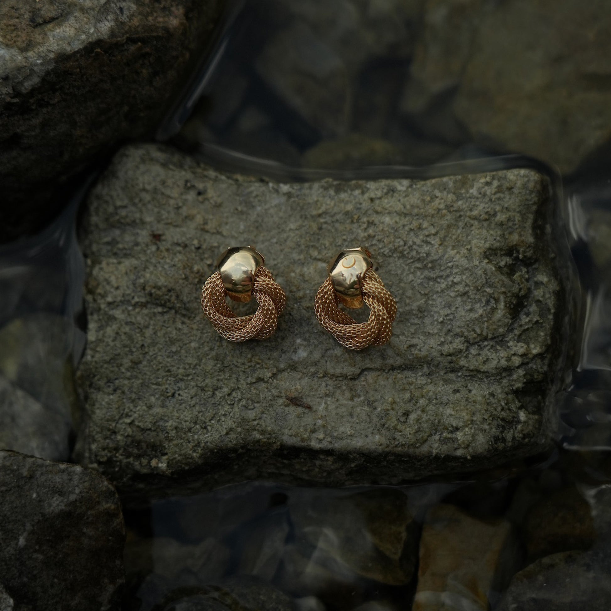 Twisted gold clip on earrings