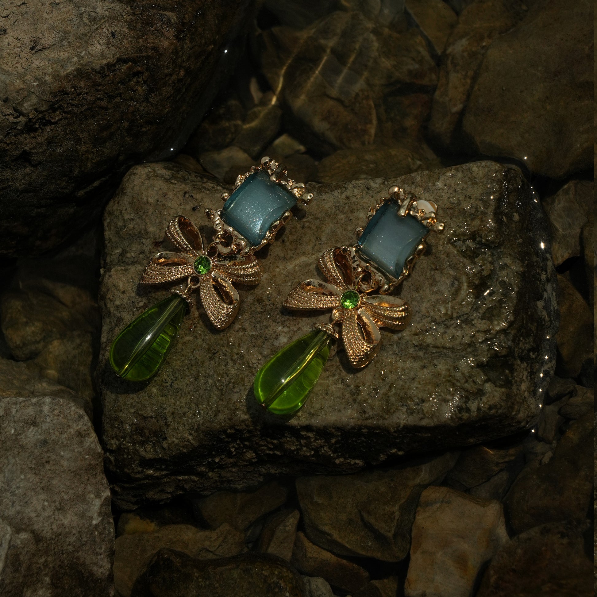 Statement gold and emerald drop clip on earrings