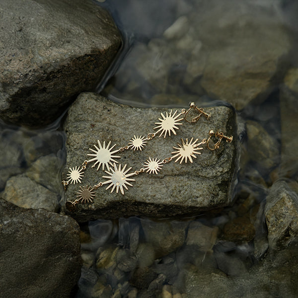 Golden sun hanging clip on earrings
