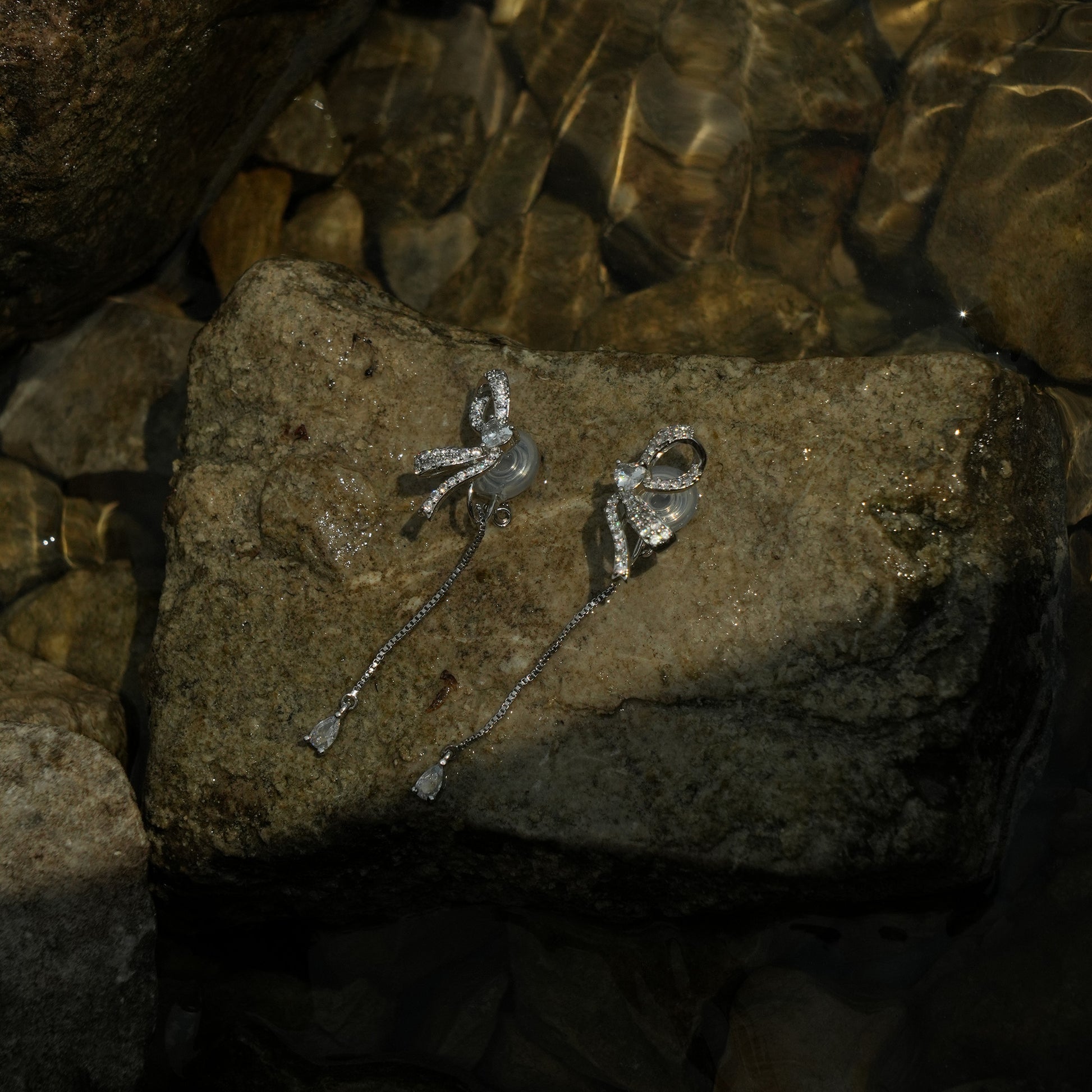 Petite silver half bow clip on earrings